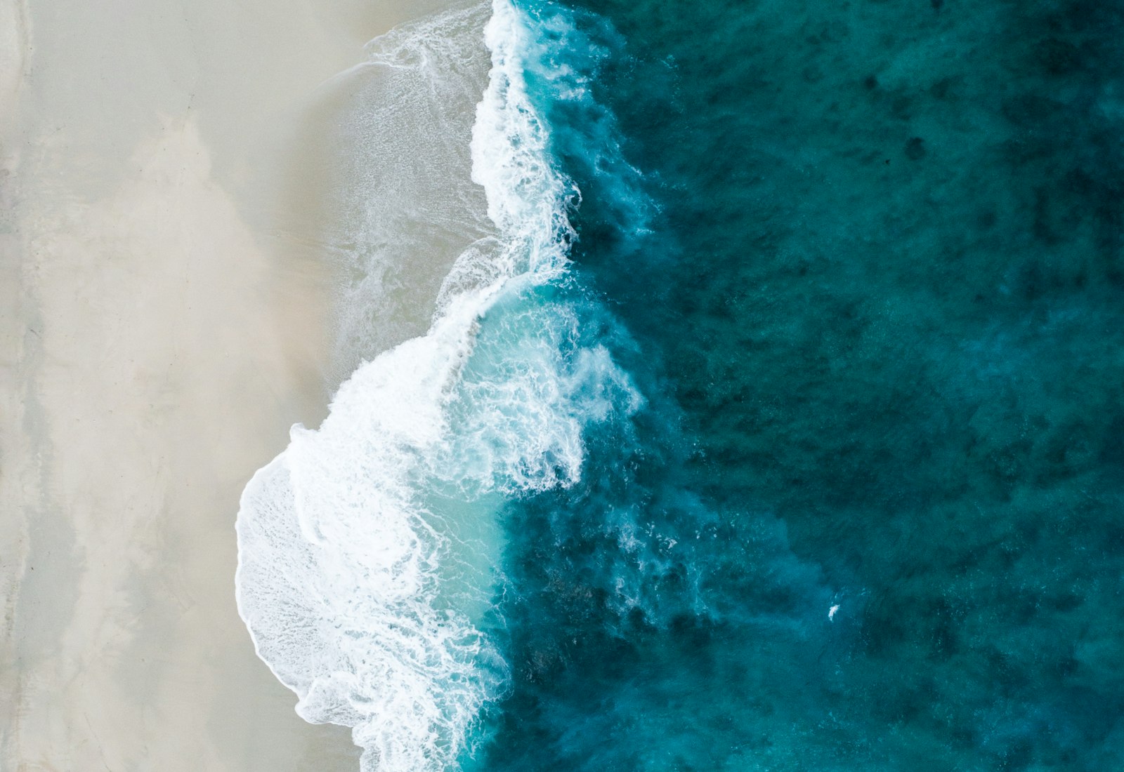 Turquoise Mediterranean water lapping the Saïdia shoreline from above