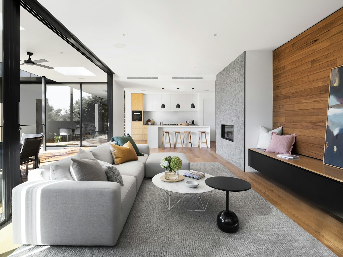 Bright modern apartment living room with warm wood and soft light